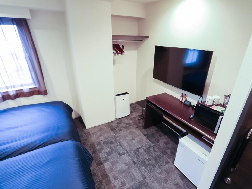 TV a/nebo společenská místnost v ubytování HOTEL LiVEMAX Niigata Ekimae
