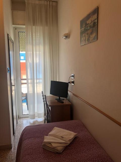 Postel nebo postele na pokoji v ubytování Hotel Zurigo