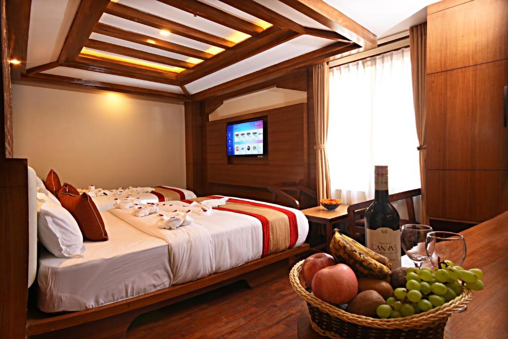 Postel nebo postele na pokoji v ubytování Hotel Thamel Park