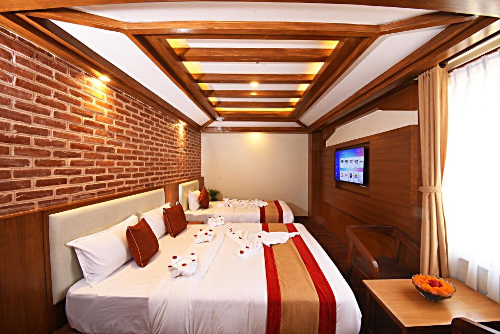 Postel nebo postele na pokoji v ubytování Hotel Thamel Park