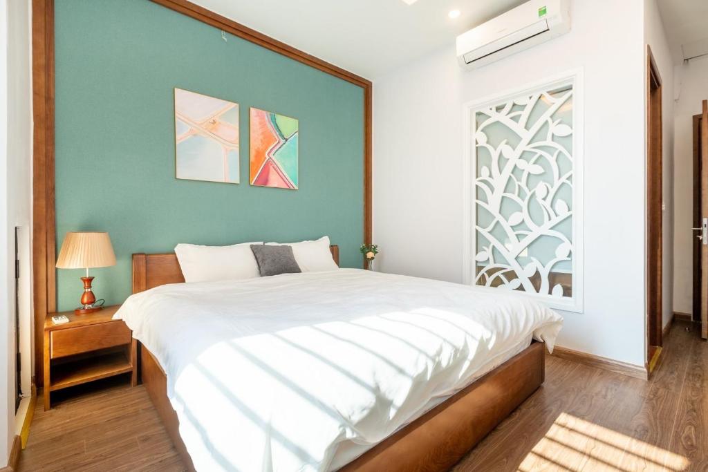 Ένα ή περισσότερα κρεβάτια σε δωμάτιο στο My Serenity Service Apartment - West Lake