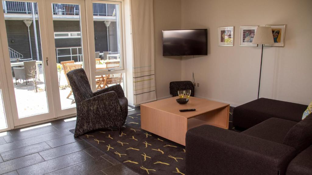 TV a/nebo společenská místnost v ubytování Hotel Strandtangen