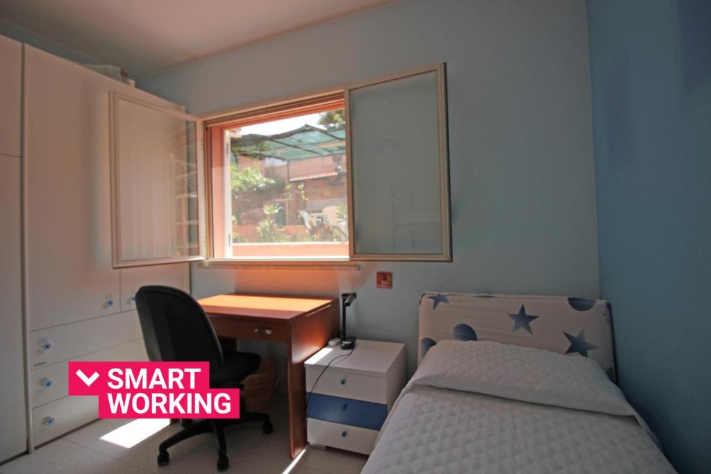 A bed or beds in a room at Villetta Santa Lucia con patio e giardino by Wonderful Italy