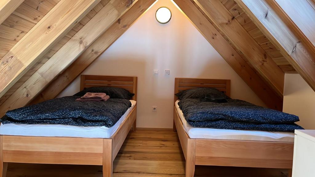 Postel nebo postele na pokoji v ubytování Apartmány Pod Jelenkou