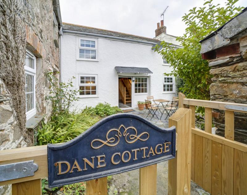 a sign in front of a home with aance cottage at Dane Cottage in Port Isaac