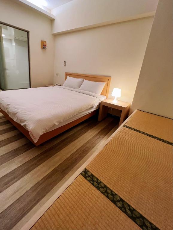 Postel nebo postele na pokoji v ubytování Hwa Hong Hotel