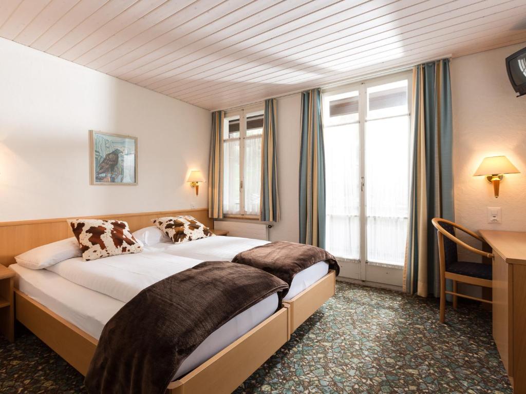Posteľ alebo postele v izbe v ubytovaní Hotel Oberland