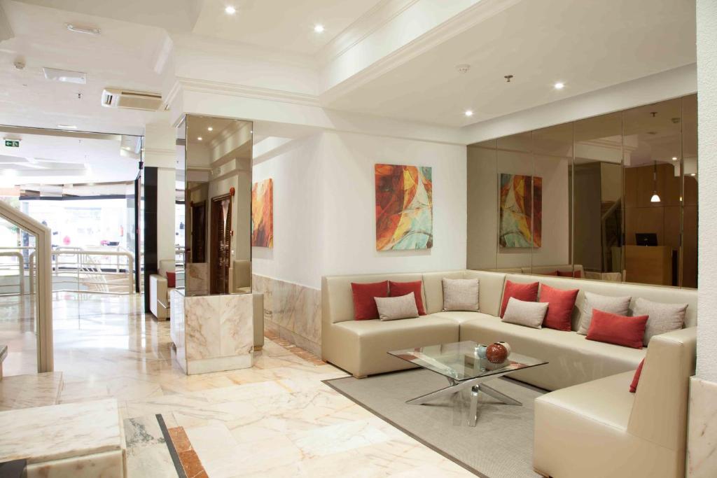 a living room with a couch and a table at Hotel Principe Paz in Santa Cruz de Tenerife
