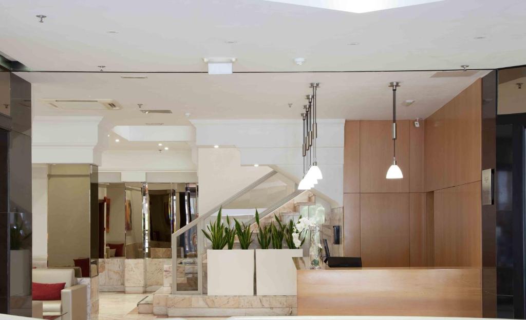 a lobby with a staircase in a building at Hotel Principe Paz in Santa Cruz de Tenerife