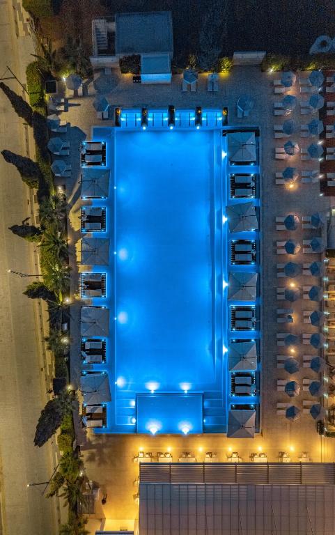 an overhead view of a pool at night at Nestor Hotel in Ayia Napa