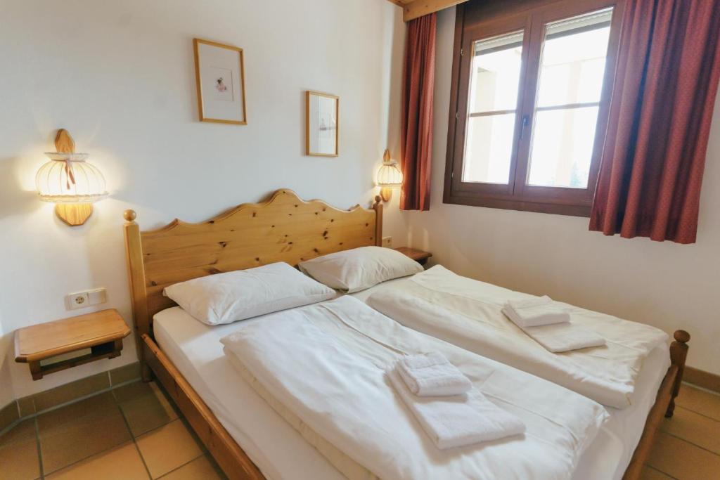 Postel nebo postele na pokoji v ubytování Apartment Zirbengeist Gerlitzen