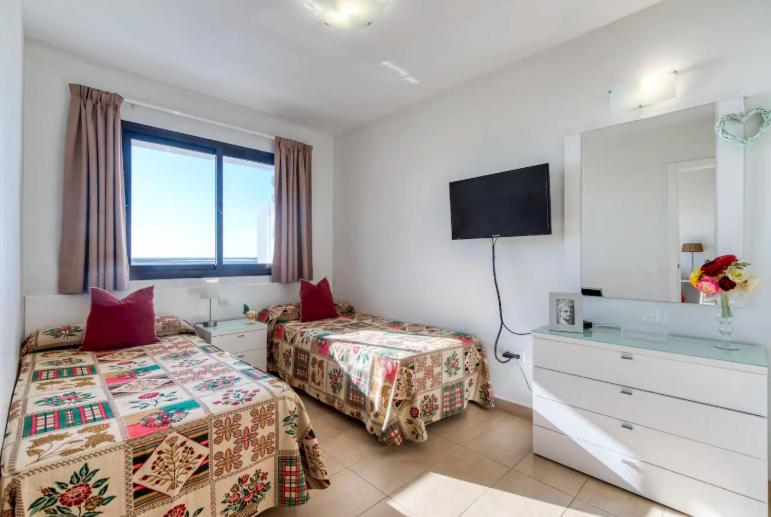 Posteľ alebo postele v izbe v ubytovaní Apartamentos Liszt