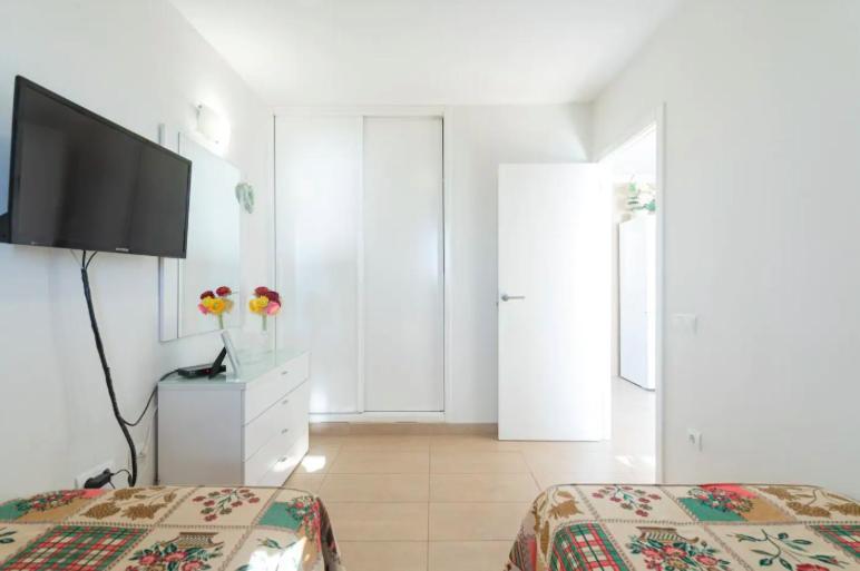 Posteľ alebo postele v izbe v ubytovaní Apartamentos Liszt