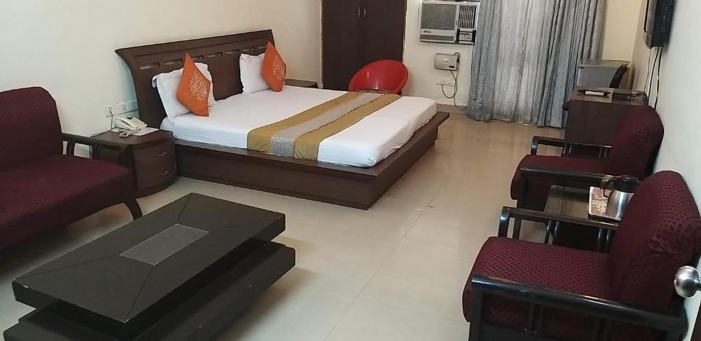 Postel nebo postele na pokoji v ubytování Hotel Home Stay Dwarka