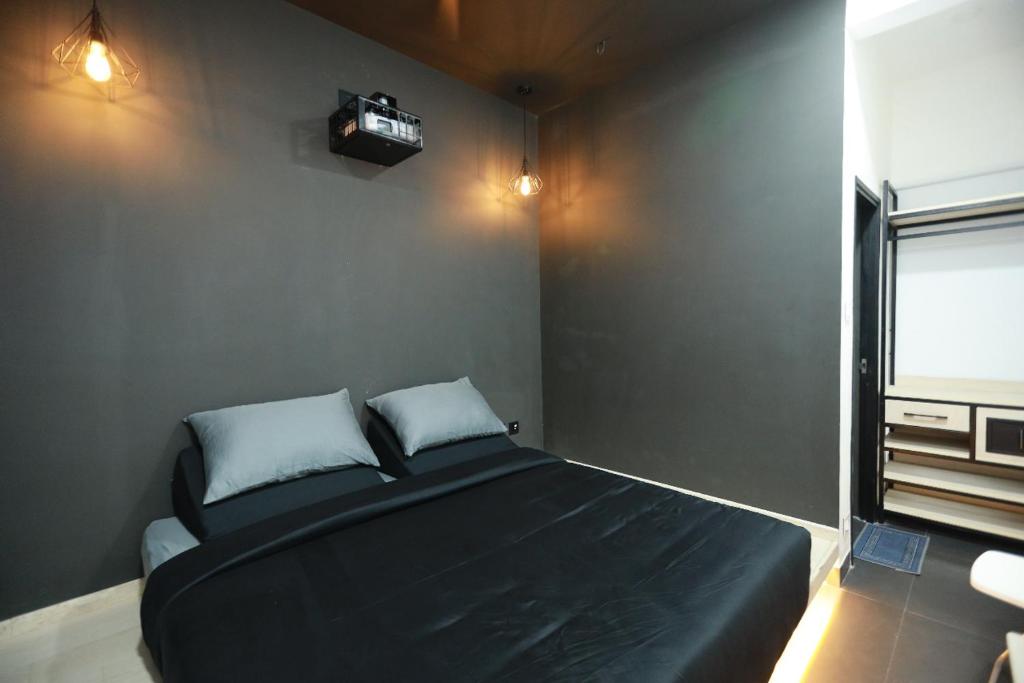 Postel nebo postele na pokoji v ubytování Hotel Cineplex