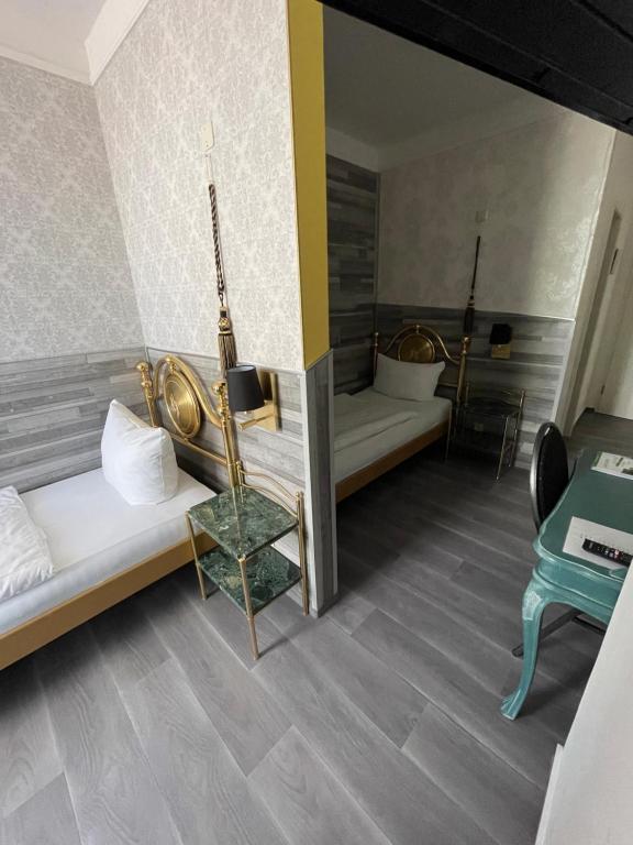 Postel nebo postele na pokoji v ubytování Haus Hennesburg, garni