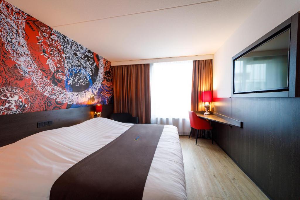 Postel nebo postele na pokoji v ubytování Bastion Hotel Maastricht Centrum