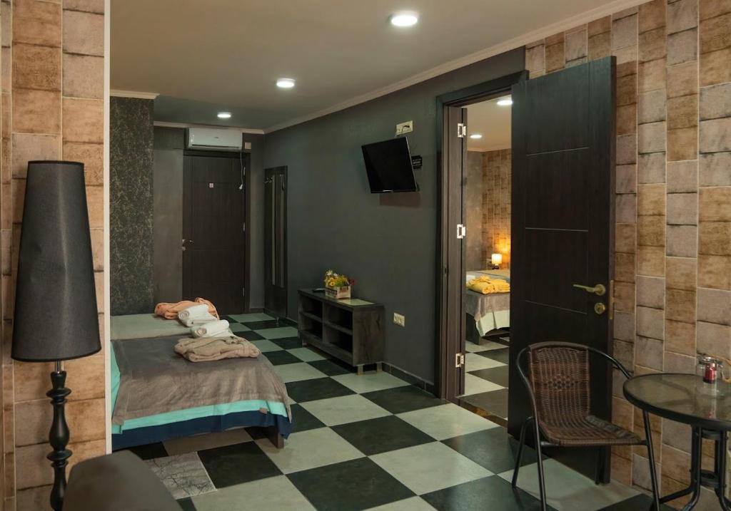 Postel nebo postele na pokoji v ubytování Batumi West Hotel