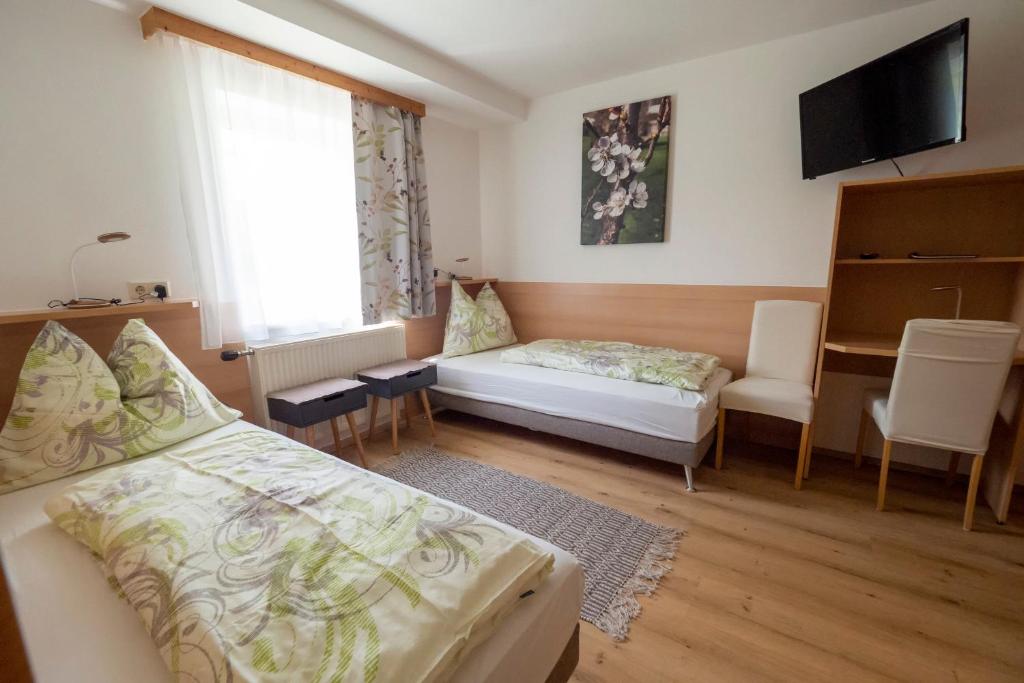 Postel nebo postele na pokoji v ubytování Gästezimmer Ilse Brauneis