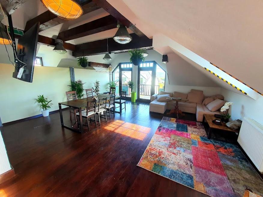 a large living room with a couch and a table at Suite Loft in Zabierzów