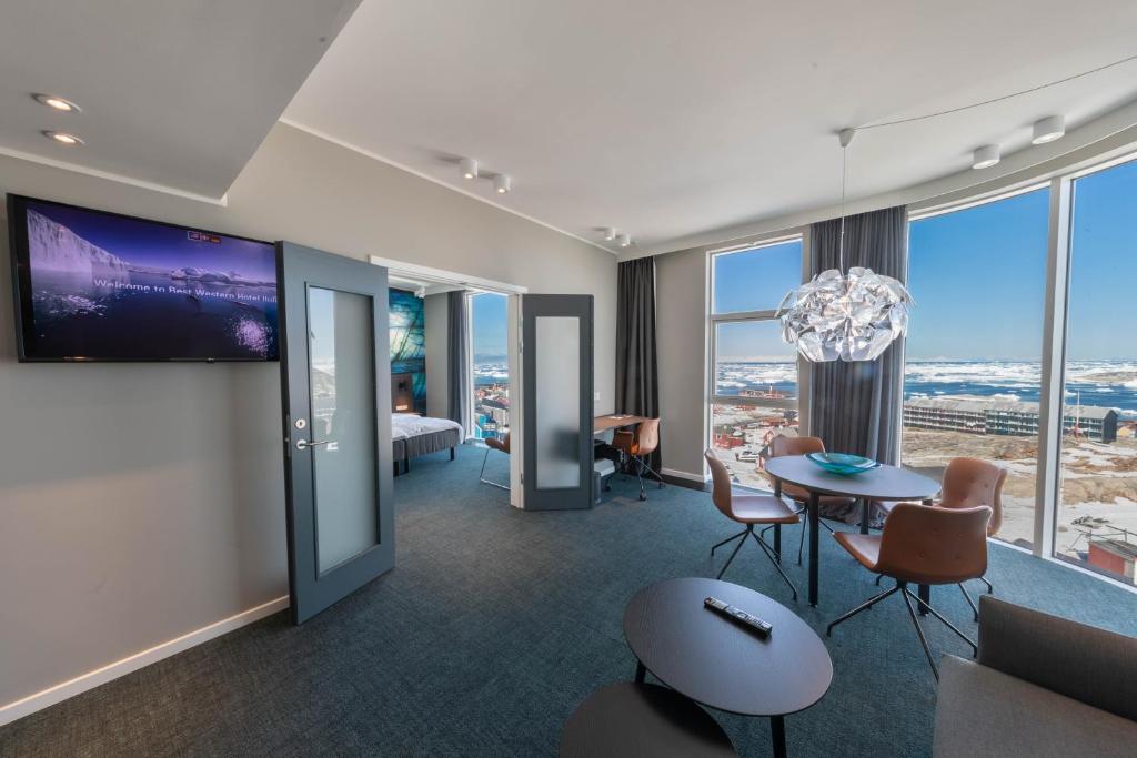 a hotel room with a view of a city at Best Western Plus Hotel Ilulissat in Ilulissat