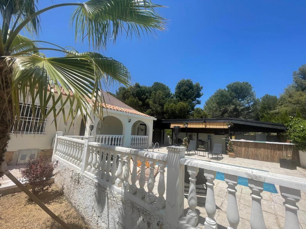 a white fence in front of a house at Villa la Vida in Alfaz del Pi