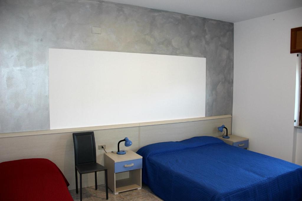 Postel nebo postele na pokoji v ubytování Lucantò Accommodations