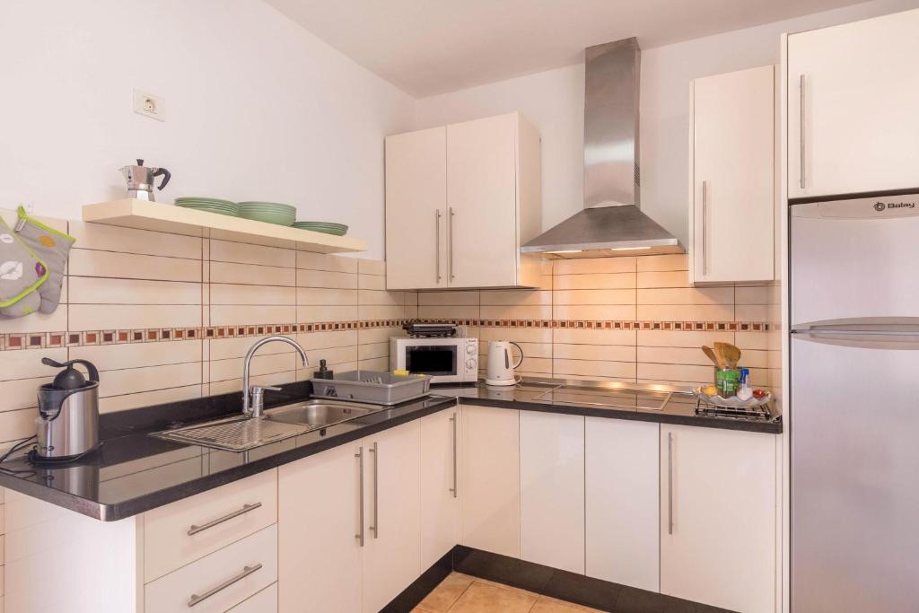 Kuchyň nebo kuchyňský kout v ubytování Apartamento B Armonia Rural