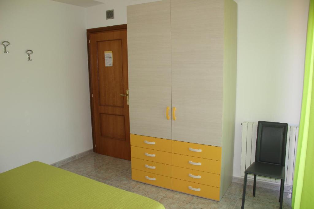 Postel nebo postele na pokoji v ubytování Lucantò Accommodations