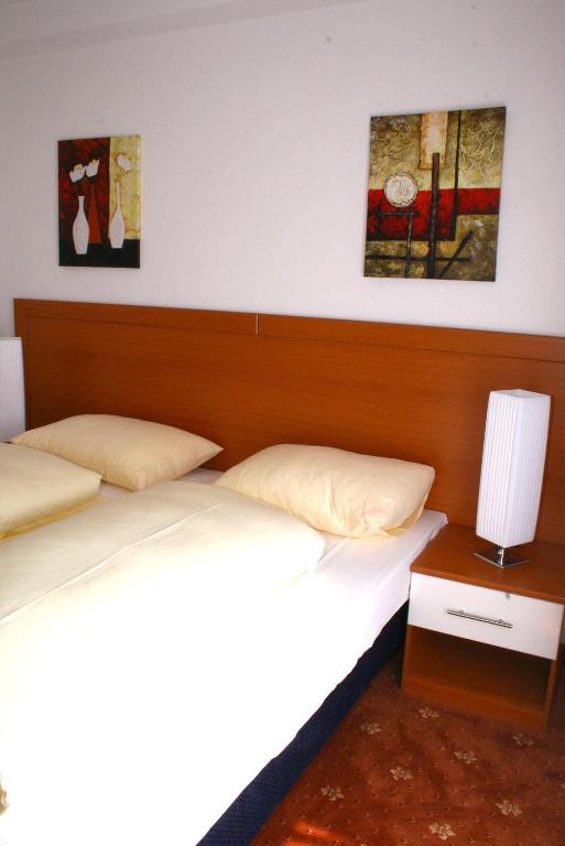 Postel nebo postele na pokoji v ubytování Hotel Evido Salzburg City Center