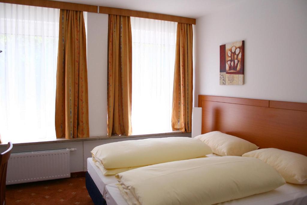 Postel nebo postele na pokoji v ubytování Hotel Evido Salzburg City Center