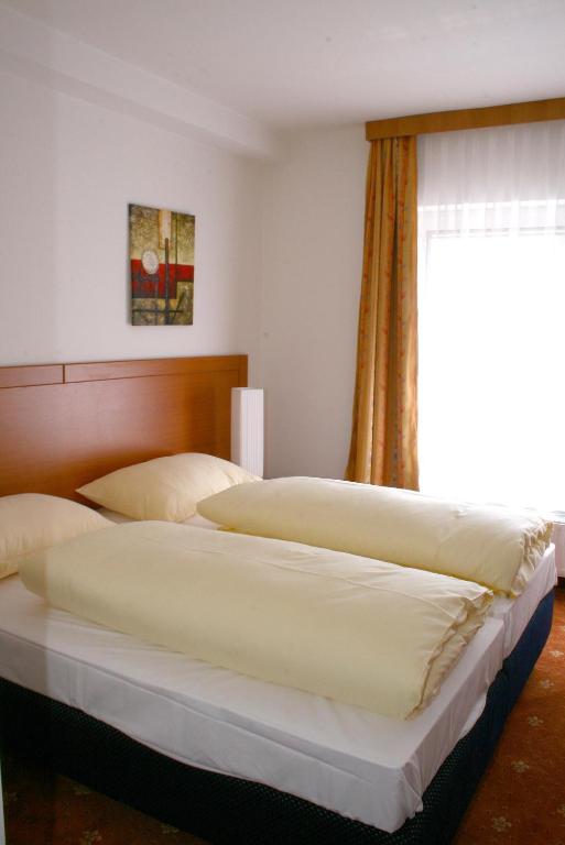 Postel nebo postele na pokoji v ubytování Hotel Evido Salzburg City Center