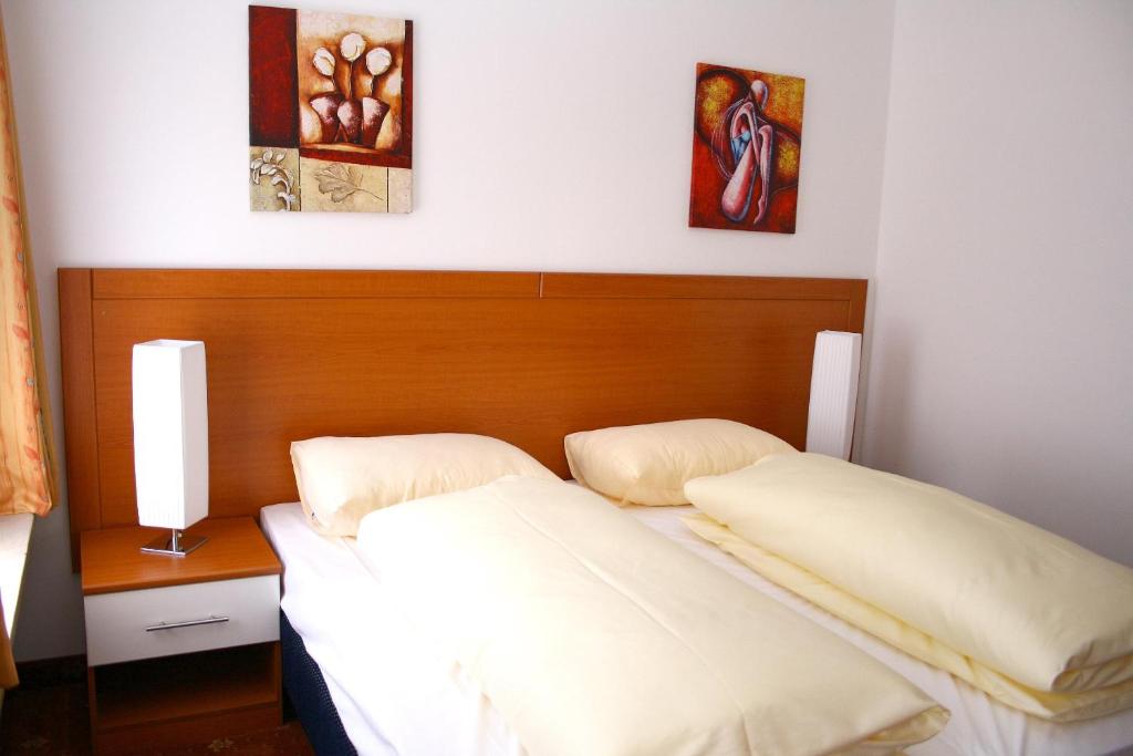 Postel nebo postele na pokoji v ubytování Hotel Evido Salzburg City Center