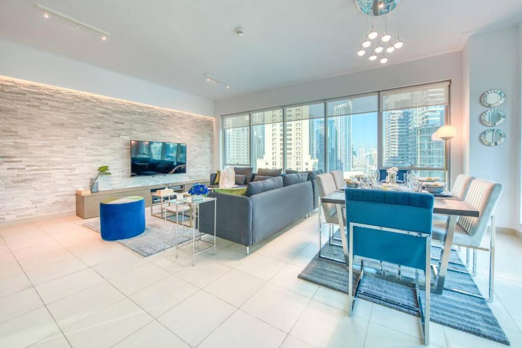 a living room with a couch and a table at Attessa Tower, Marina Promenade, Dubai Marina - Mint Stay in Dubai