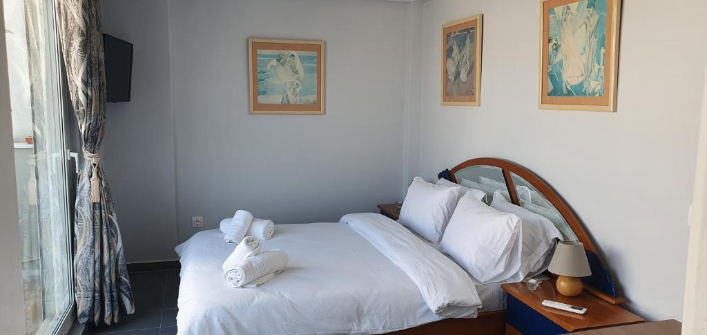 Posteľ alebo postele v izbe v ubytovaní Nikis Penthouse