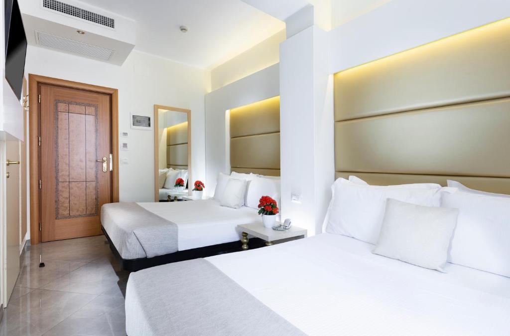 Postel nebo postele na pokoji v ubytování Hotel Gallia Palace