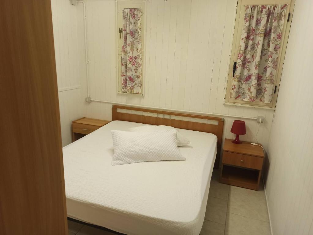 Postel nebo postele na pokoji v ubytování Camping Poseidonia