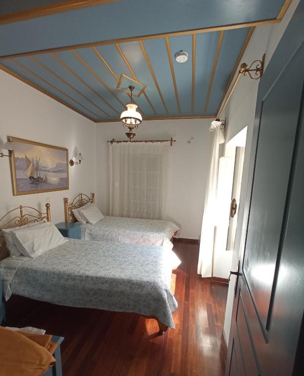 A bed or beds in a room at Traditional Stone Villa Olympia