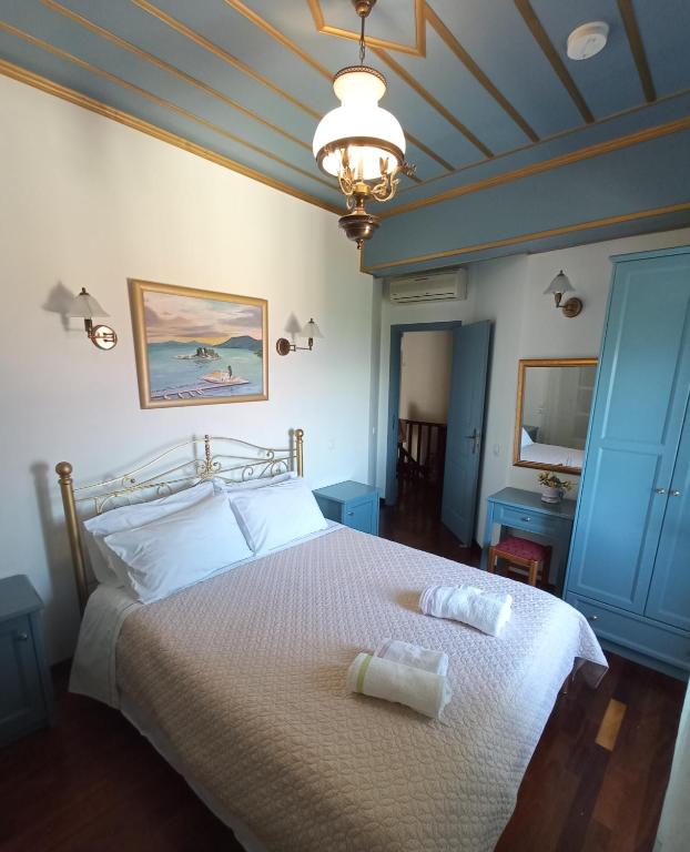 A bed or beds in a room at Traditional Stone Villa Olympia
