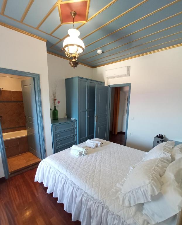A bed or beds in a room at Traditional Stone Villa Olympia