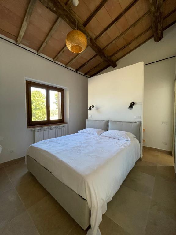 Katil atau katil-katil dalam bilik di Maremma Country Chic (il Gelsomino)