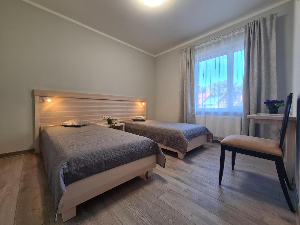 Postel nebo postele na pokoji v ubytování Viesu nams UPE