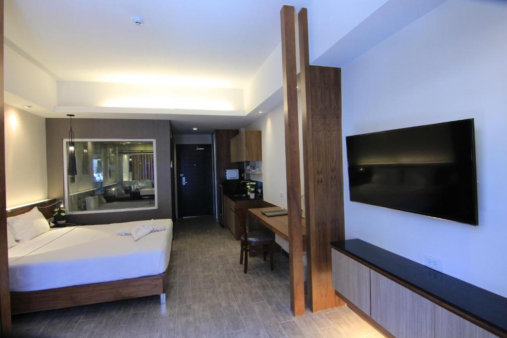 TV a/nebo společenská místnost v ubytování Inn Residence Serviced Suites - SHA Extra Plus
