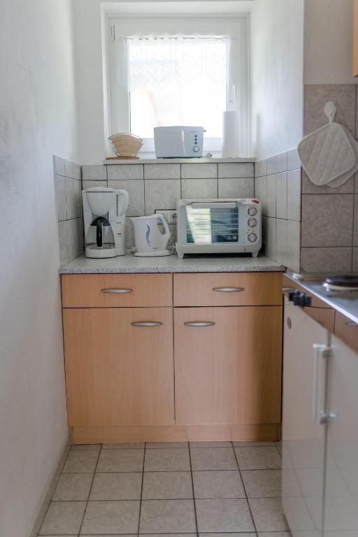 Kuchyň nebo kuchyňský kout v ubytování Ferienwohnungen Rijawetz