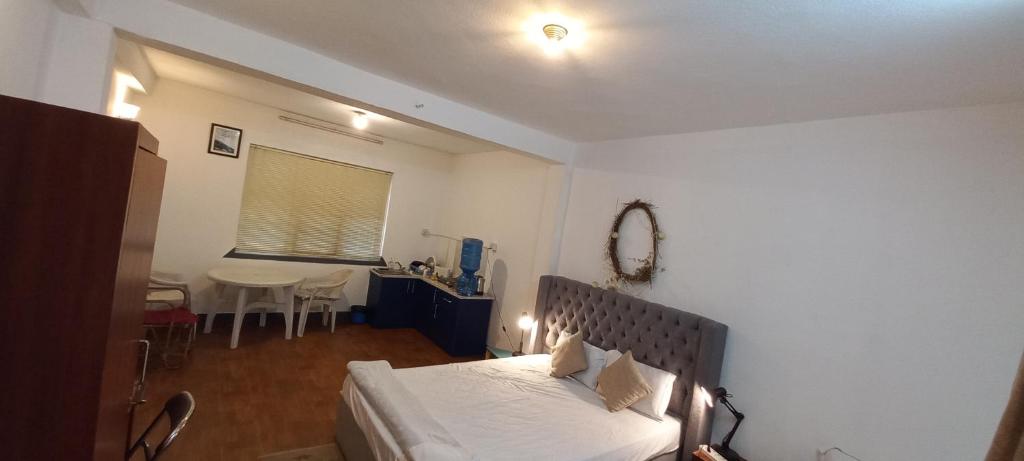 Postel nebo postele na pokoji v ubytování KAJI HOME
