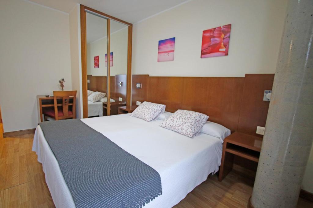 Postel nebo postele na pokoji v ubytování Villa de Colunga