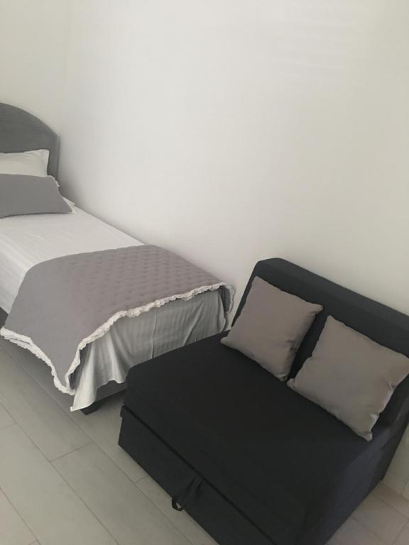 Posteľ alebo postele v izbe v ubytovaní Perla Luxury Apartment