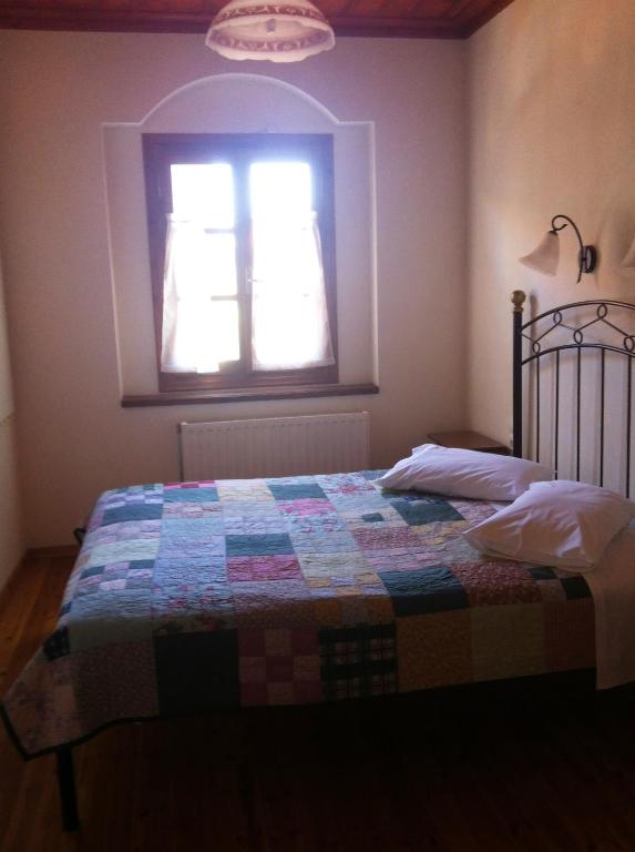 Łóżko lub łóżka w pokoju w obiekcie Guesthouse Kolenti