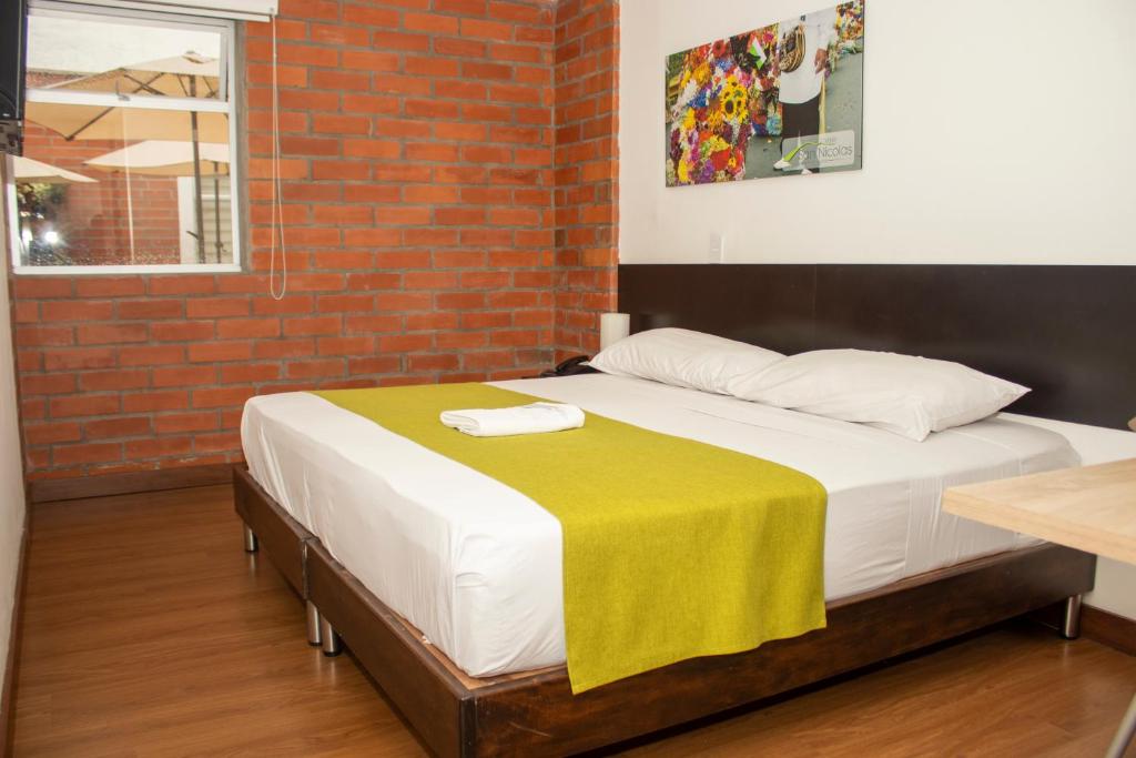 Postel nebo postele na pokoji v ubytování Hotel Valle de San Nicolas