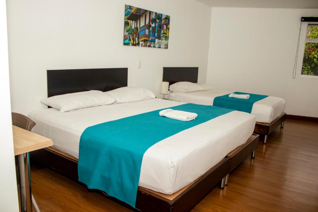Postel nebo postele na pokoji v ubytování Hotel Valle de San Nicolas